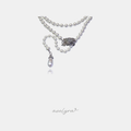 White pearl bead necklace with a crystal-set silver-tone ornamental clasp and a teardrop pearl drop pendant.