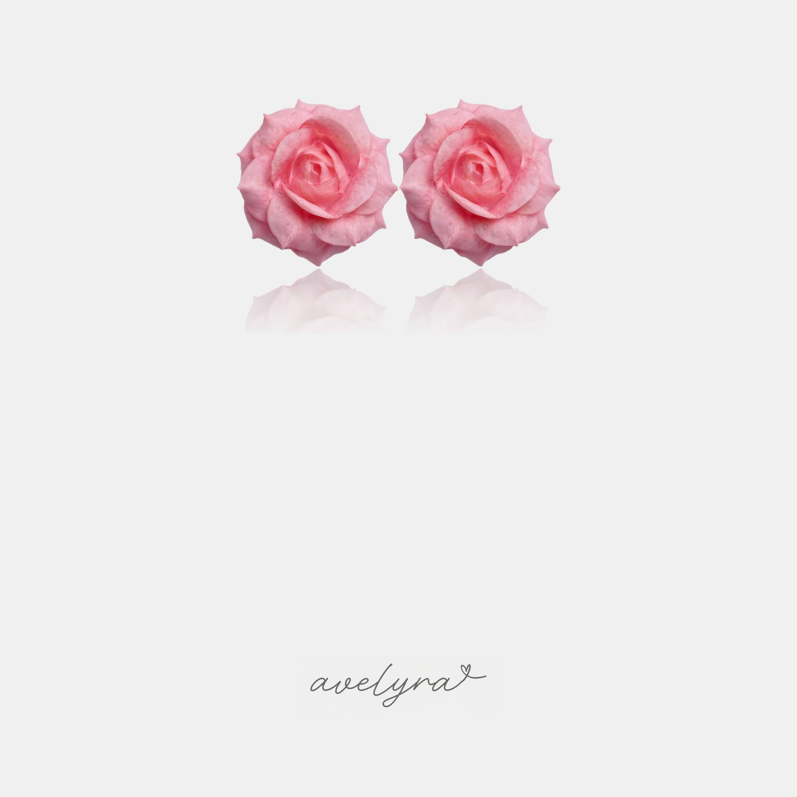 Pink rose bloom stud earrings resembling a real garden rose