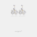 Gold-tone drop earrings with two round white pearls above a cluster of ivory pearlescent petals.