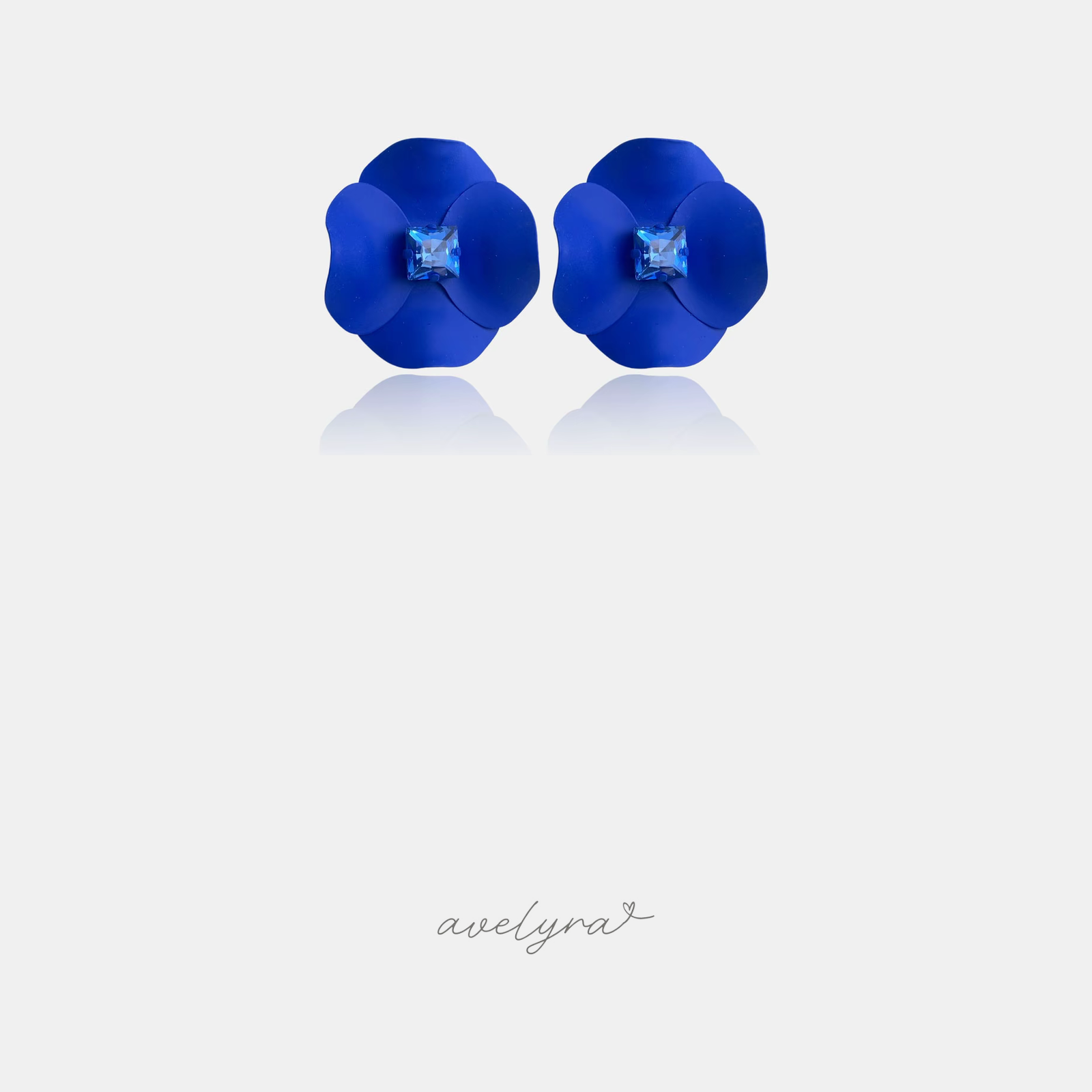 Royal-blue matte flower stud earrings with a square crystal centre
