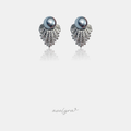Pair of stud earrings with grey pearls above a fanned cluster of clear crystals.