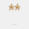 Pink five-petal flower stud earrings with gold-tone outlines and clustered crystals at the centre.