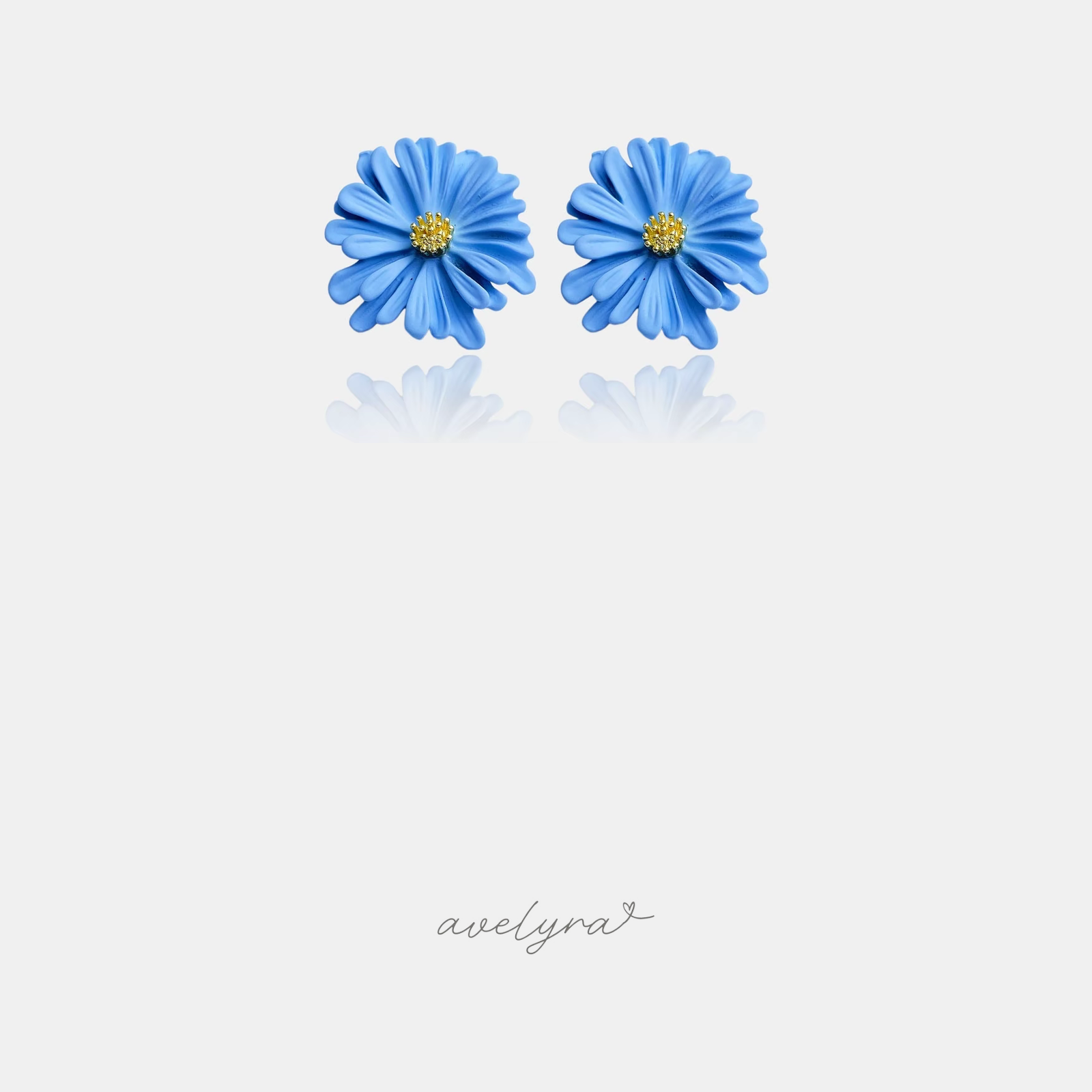 Blue daisy flower stud earrings with layered petals and a small golden centre.