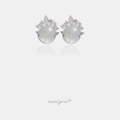 Stud earrings with a round white dome below a fan of clear crystal stones.