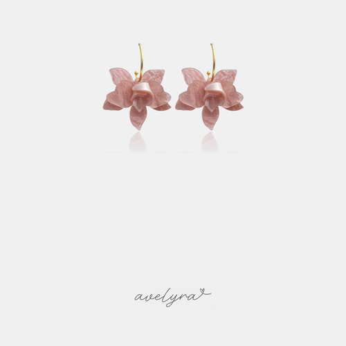 Gold-tone hoop earrings with a pearlescent blush-pink orchid flower