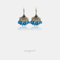 Gold-tone hook earrings with pave-set tops and clusters of blue faceted teardrop beads.