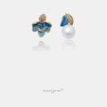 Mismatched gold-tone stud earrings: one blue enamel flower with pave leaf, one white pearl with blue petal.