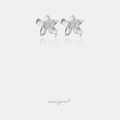 Silver-tone lily flower stud earrings with curved petals and a clear square stone in the centre.