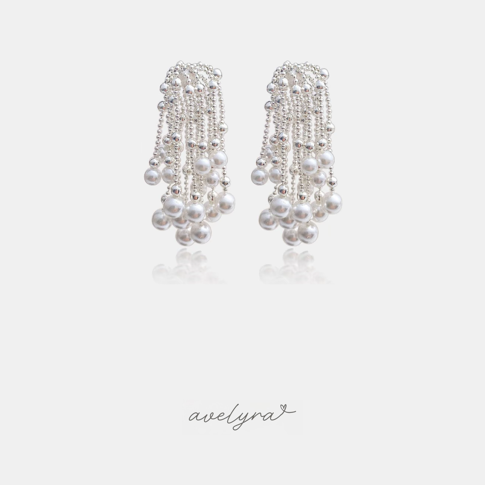 Silver-tone bead-chain tassel earrings cascading with white pearls