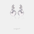 Silver-tone stud earrings with a cluster of small clear crystals set above a smooth round clear glass bead.