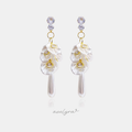 Gold-tone drop earrings with two clear crystals above ruffled white pearlescent petals, gold-framed crystals, and a long teardrop pearl.