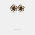 Pair of flower stud earrings with champagne petals outlined in black and a black crystal centre.