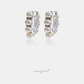 Small hoop earrings lined with alternating white pearls and clear faceted stones in a silver-tone setting.