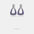 Doorknocker-shaped drop earrings paved with clear crystals at top and purple crystals below.