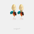 Gold-tone earrings with a smooth top and a cluster of turquoise, amber and brown beads dangling below.