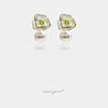 Cream enamel rose earrings with a green centre stone above a white pearl drop.