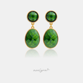 Gold-framed drop earrings with round and oval deep green marbled stones.