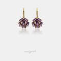 Gold-tone hook earrings with a cluster of oval purple stones.