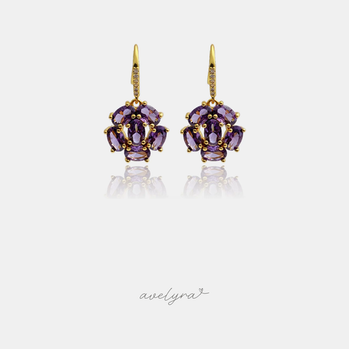 Gold-tone hook earrings with a cluster of oval purple stones.