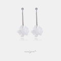 Long silver-tone crystal line earrings ending in soft white flowers.