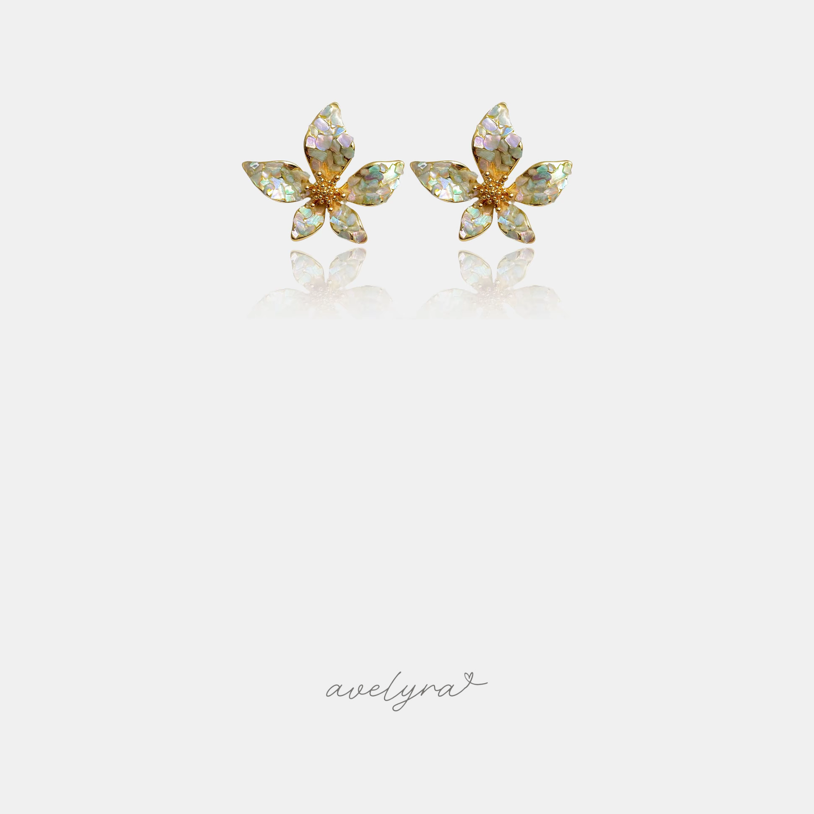 Pair of gold-tone five-petal flower stud earrings with iridescent opaline petals and a golden textured centre.