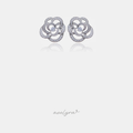 Pair of silver-tone camellia flower stud earrings with swirling pave clear stones around a central round stone.