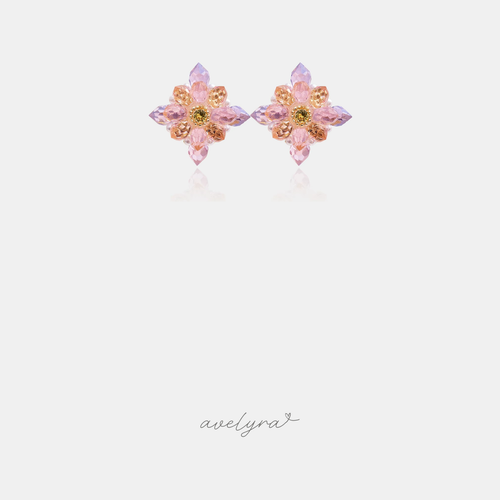 Pair of flower stud earrings with faceted pink, lilac and amber crystal petals around a golden centre stone.