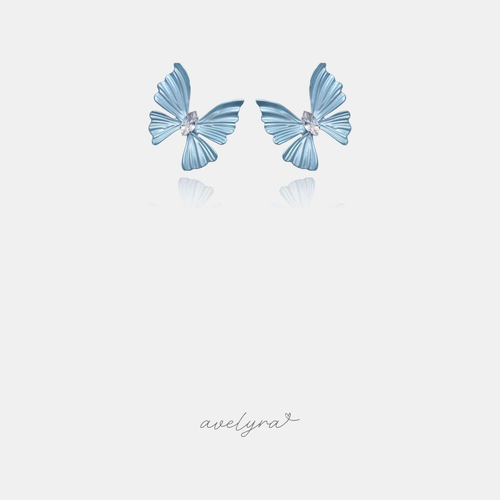 Powder-blue butterfly stud earrings with a clear marquise crystal at the centre.