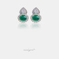 Silver-tone stud earrings with a green oval cabochon, crystal halo and teardrop crystal top.