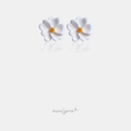 White sculpted flower stud earrings with curled petals and a gold-tone textured centre.