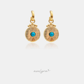 Gold-tone huggie hoops with engraved sunburst coin drops and a turquoise-blue centre stone.