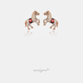 Rose gold-tone horse stud earrings paved with clear stones and red and black accents.