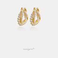 Gold-tone hoop earrings wrapped with rows of small white pearls.