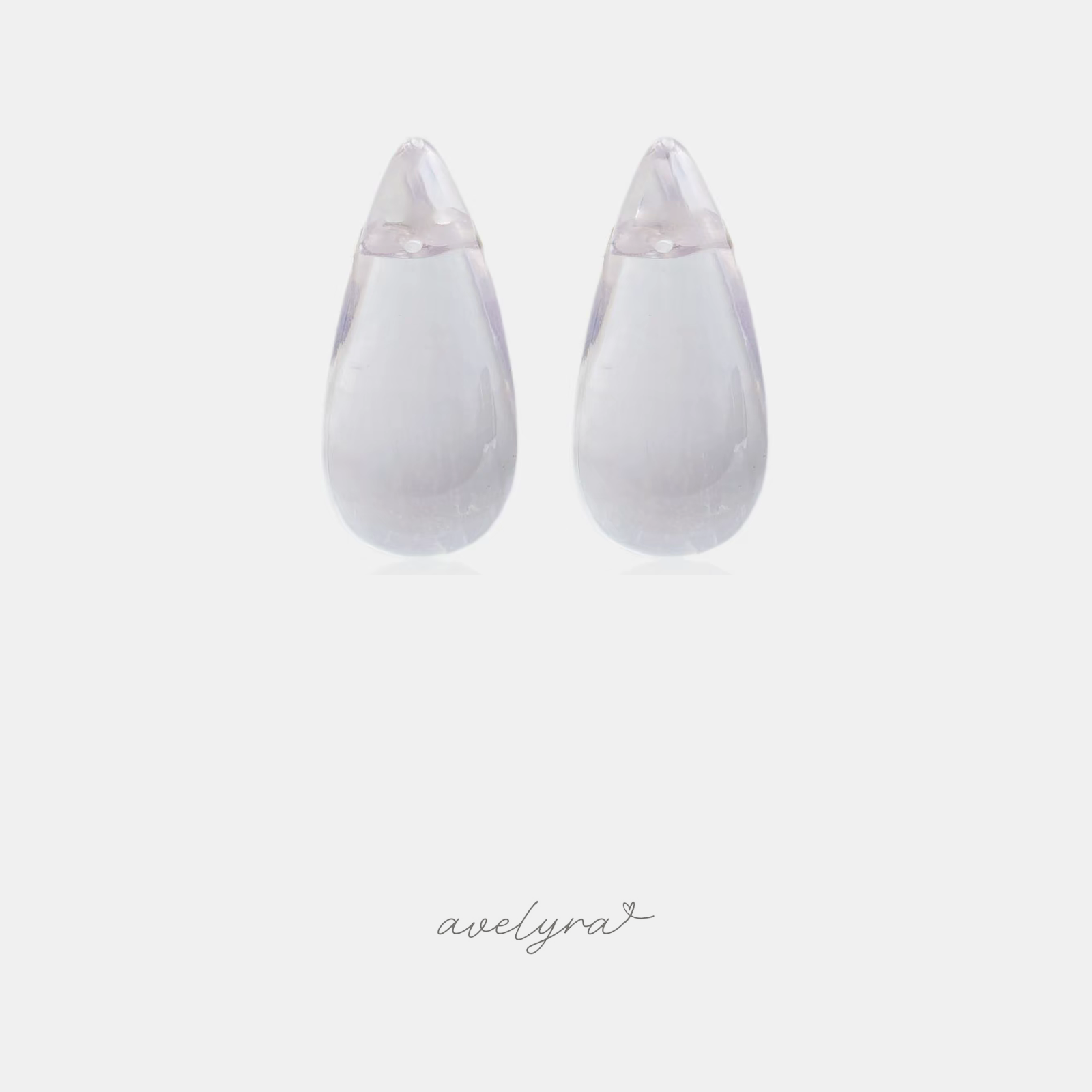 Clear smooth teardrop-shaped stud earrings.