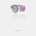 Silver-tone open ring with a white oval cabochon in a crystal halo and a round pink cabochon
