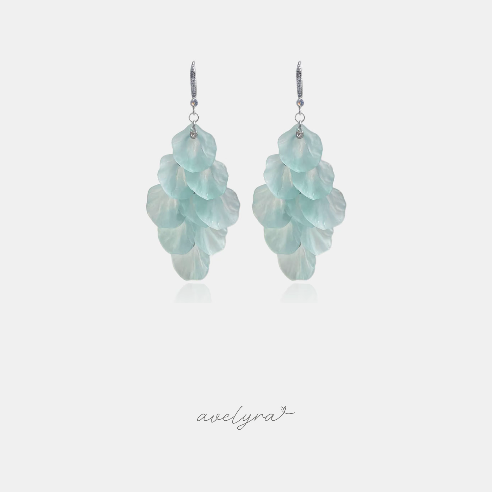 Silver-tone hook earrings with cascading layers of mint-green petals.