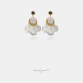 Gold-tone drop earrings with a navy round crystal, an iridescent disc set in gold filigree, and ruffled white shell-like petals below.