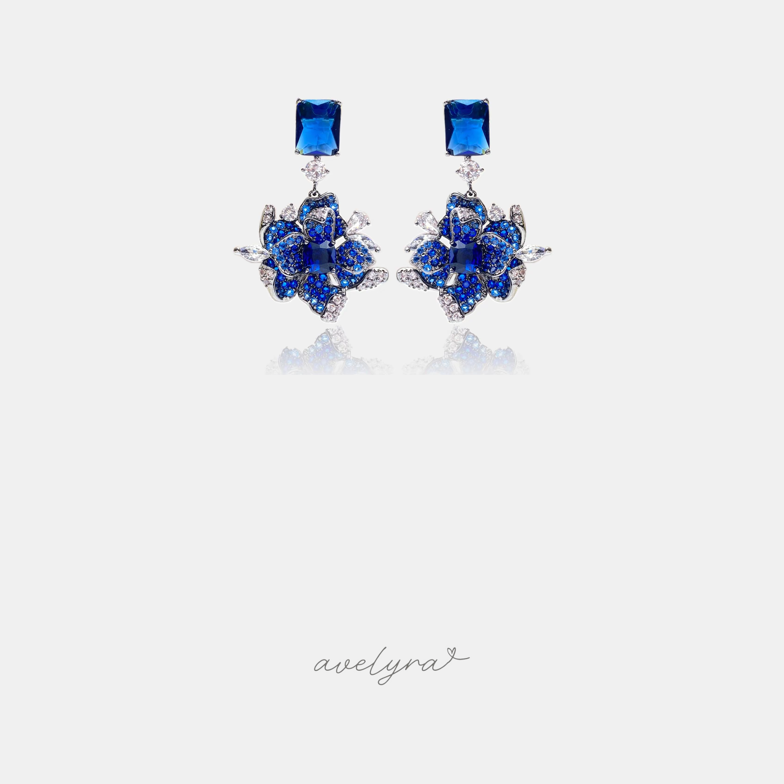 Deep blue pave crystal rose drop earrings with clear marquise crystal leaves and a blue square-crystal top