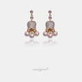 Rose gold-tone drop earrings with pink pave tulip-shaped flowers above clusters of pink pearls.