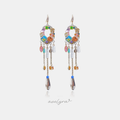 Gold-tone chandelier earrings with a jewelled ring and colorful beaded chain tassels.
