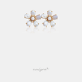 White shell-petal flower stud earrings with a gold-tone crystal centre.