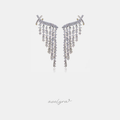 Silver-tone climbing earrings with dense clear crystals arranged in graduated fringe that tapers to a point.