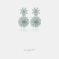 Silver-tone drop earrings with two mint-green flowers, each with marquise petals around a pave crystal center.