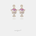 Gold-tone chandelier earrings with tiered fans of pink and purple baguette crystals and pave crescents.