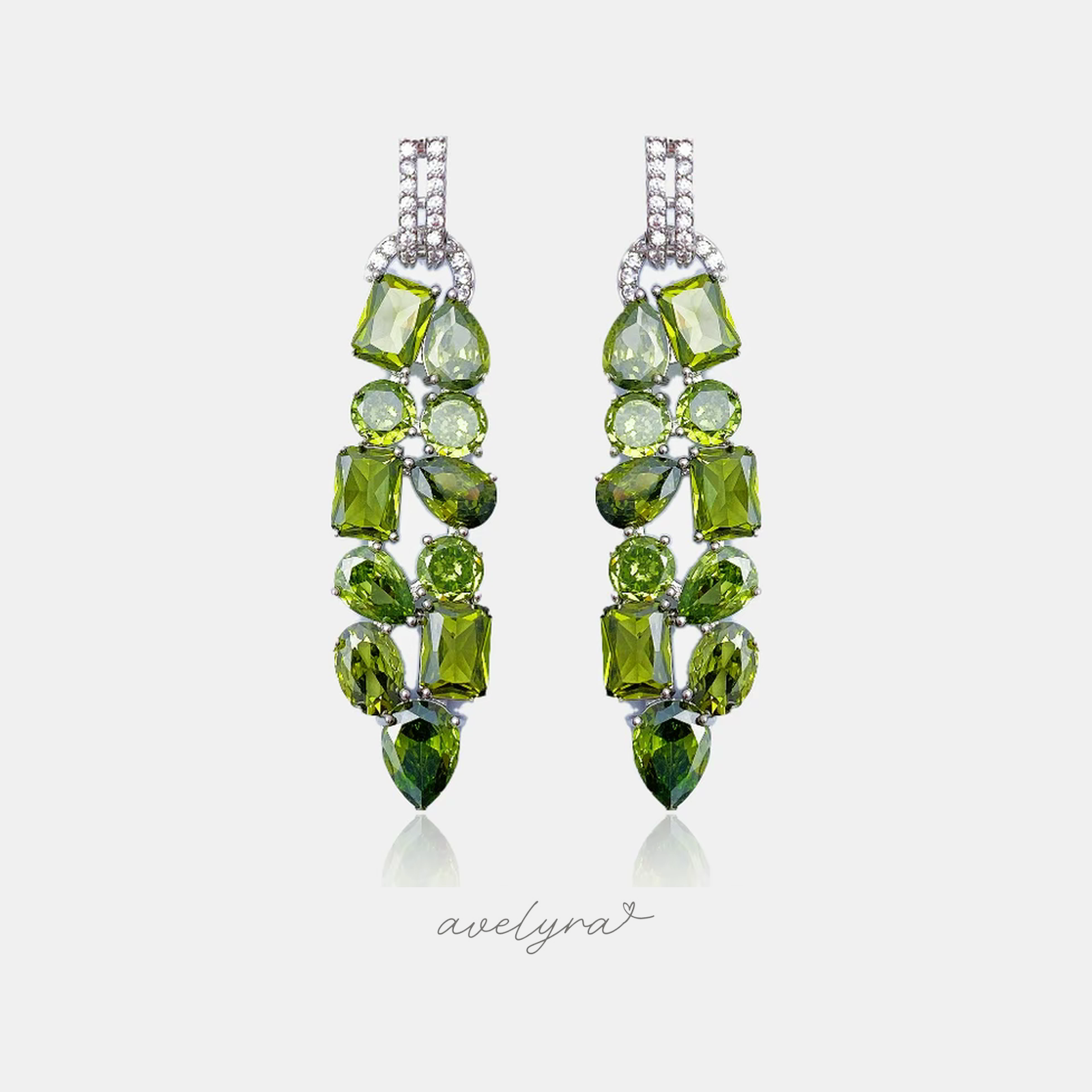 Pair of long drop earrings clustered with faceted olive-green stones in mixed shapes.