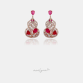 Pair of ornate drop earrings with crimson and pink stones, small pearls and pave scrollwork.