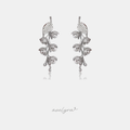 Pair of silver leaf-vine climber earrings set with crystals and small pearls.