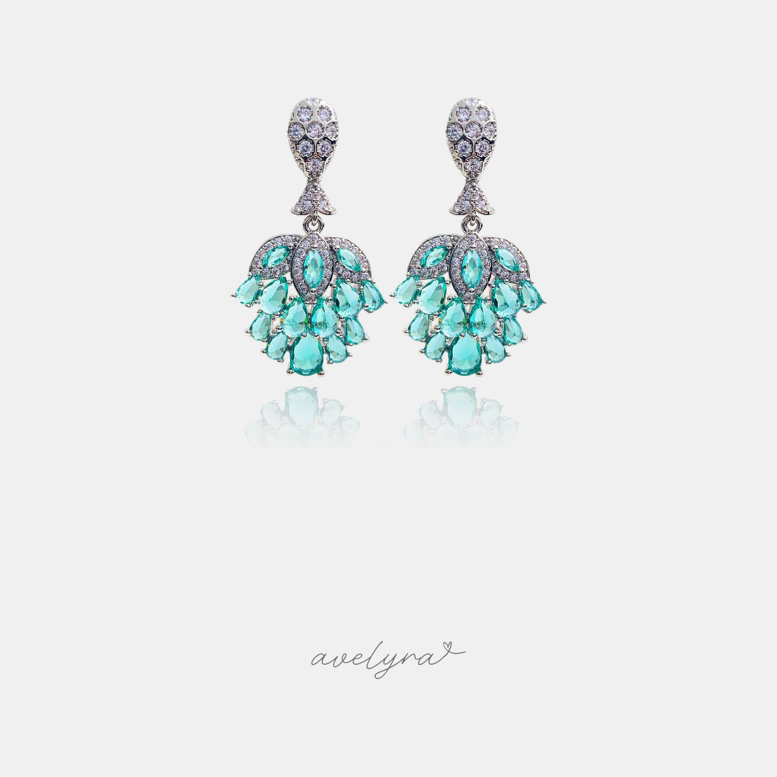 Pair of chandelier drop earrings with clustered aqua teardrop stones and a pave stem.