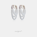 Pair of hoop earrings formed from rows of white pearls with a pave crystal upper section.