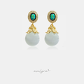 Gold-tone drop earrings with iridescent green-blue oval tops and pale round bead drops.